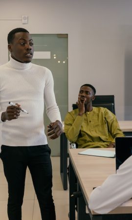 Photo by Mikhail Nilov: https://www.pexels.com/photo/man-in-white-sweater-making-a-business-presentation-9301255/